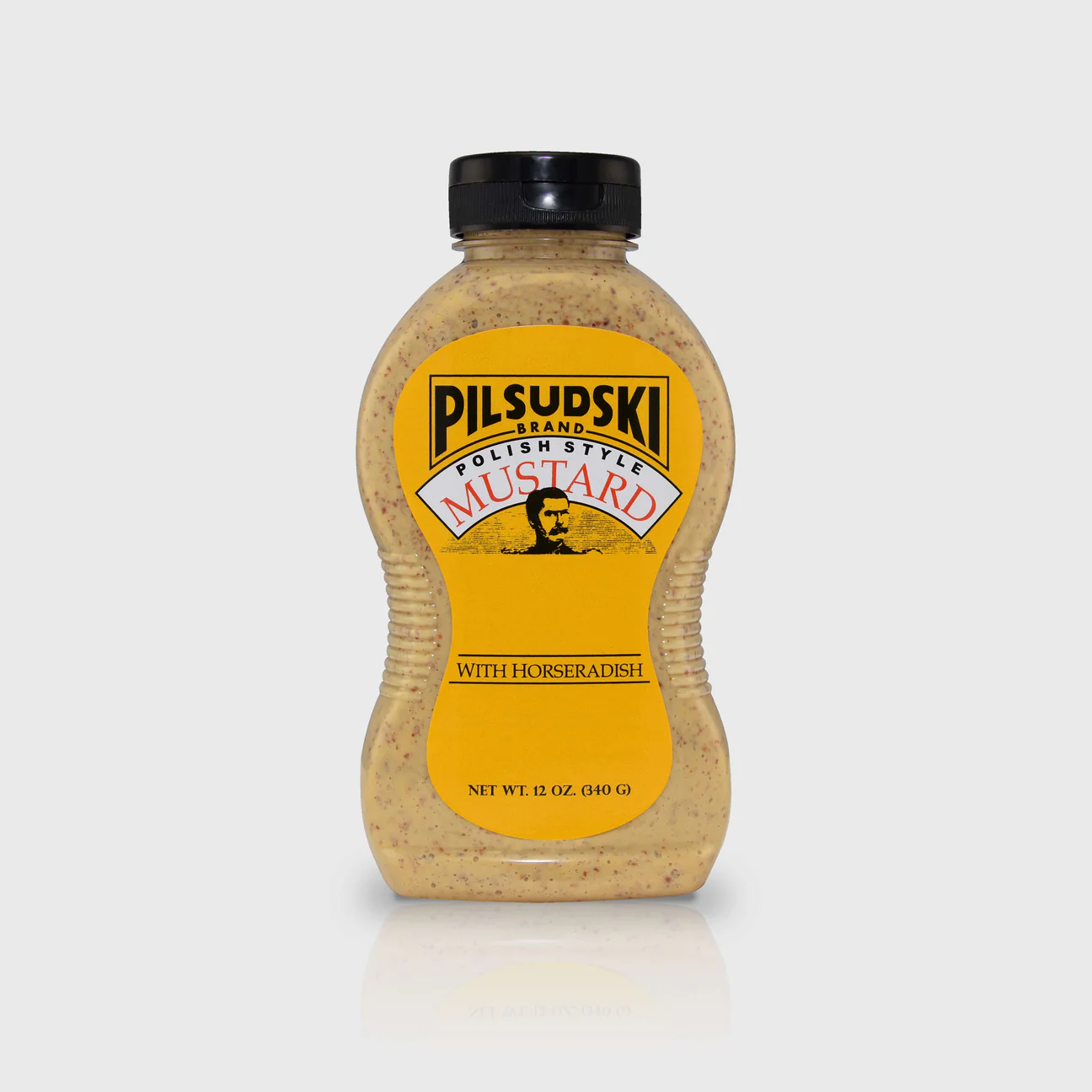 A bottle of Pilsudski Mustard with Horseradish, displaying the label and cap against a white background.