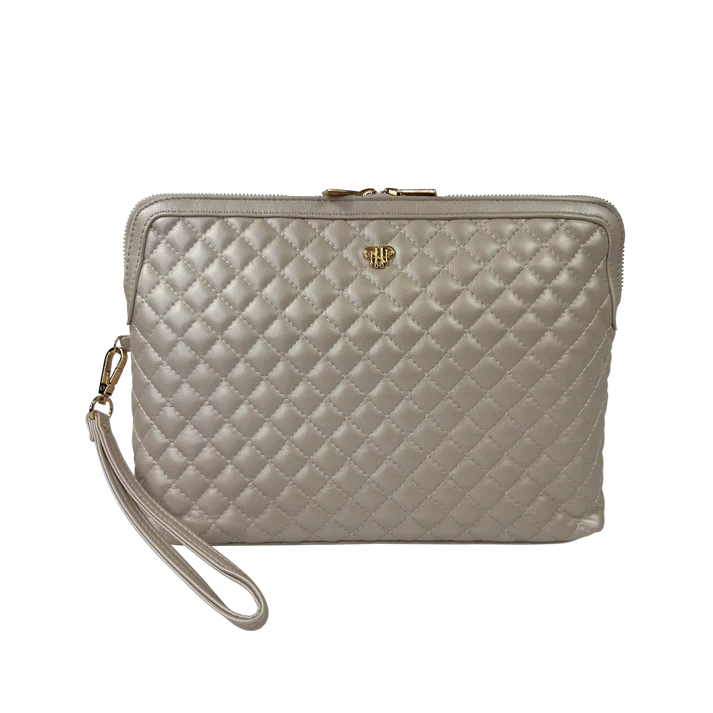 Quilted beige handbag with a strap on a white background