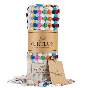A stack of multicolored hand towels with a geometric pattern.