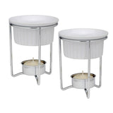 A set of two ceramic butter warmers with silver metal stands and white candle holders.