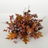 A decorative fall-themed berry leaf orb with orange leaves and multicolored berries.