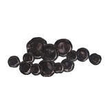A wall decor made of black and dark gray spherical objects of varying sizes arranged unevenly on a white background.