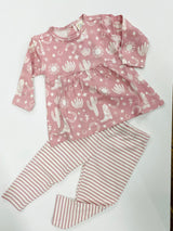 Children's two-piece outfit with a pink top featuring cactus patterns and striped leggings, laid flat on a white background.