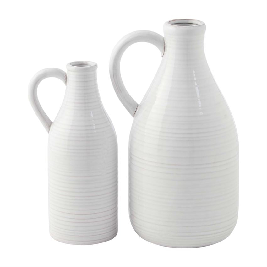 Two white ceramic vases with handles, one larger than the other, against a white background.