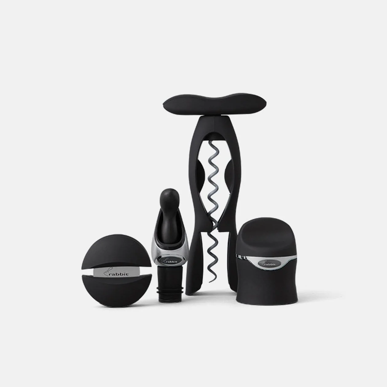 A set of four wine tools including a corkscrew, a foil cutter, a wine pourer, and a stopper, all in black color.