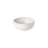 A white ceramic cereal bowl with a wide opening on a plain background.