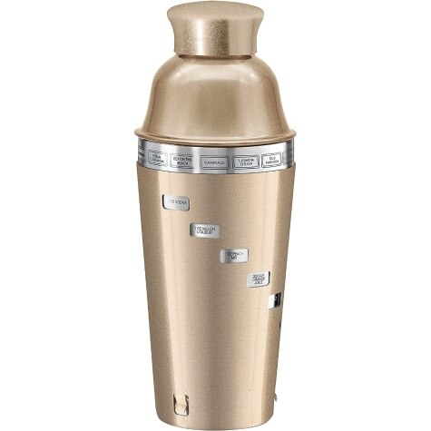 A gold-colored cocktail shaker with a dial on the top and a label on the front.