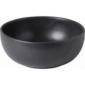 A black, round ceramic serving bowl.