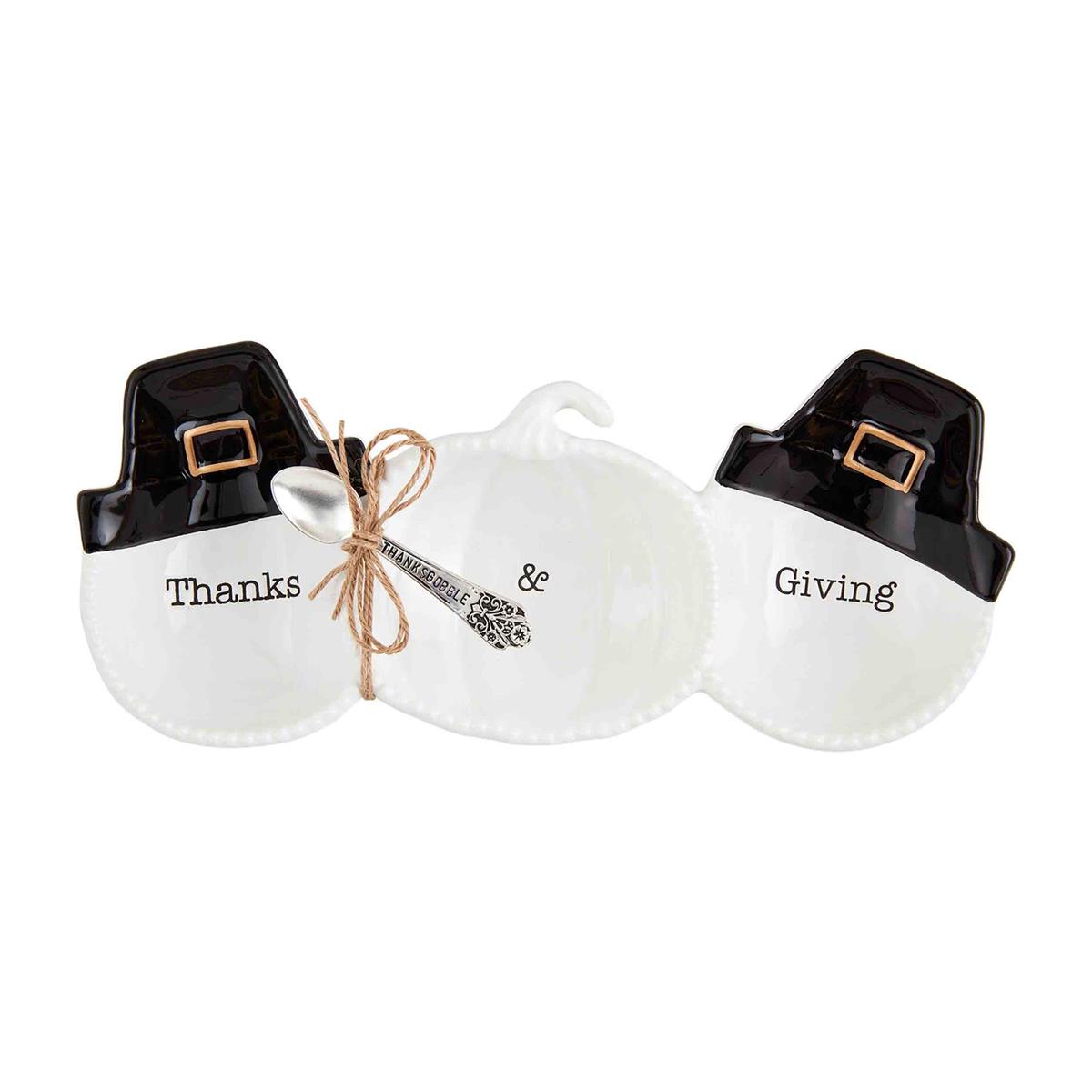 Two white ceramic dishes with black Pilgrim hats on top, one labeled 'Thanks' and the other ' Giving', tied with a decorative ribbon, and a small ceramic turkey.