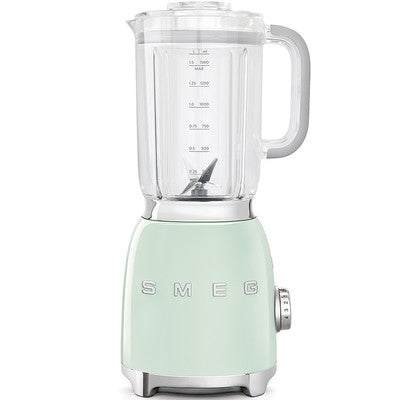 A SMEG brand blender with a clear container and a green and white exterior.