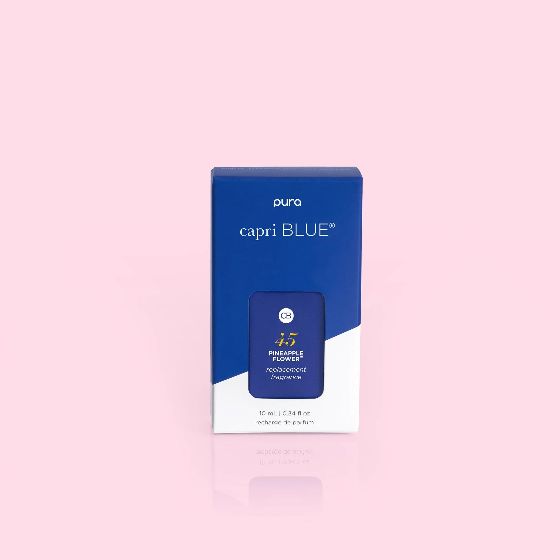 A box of Pura brand fragrance oil refill, with the name 'capri BLUE' visible on the packaging.