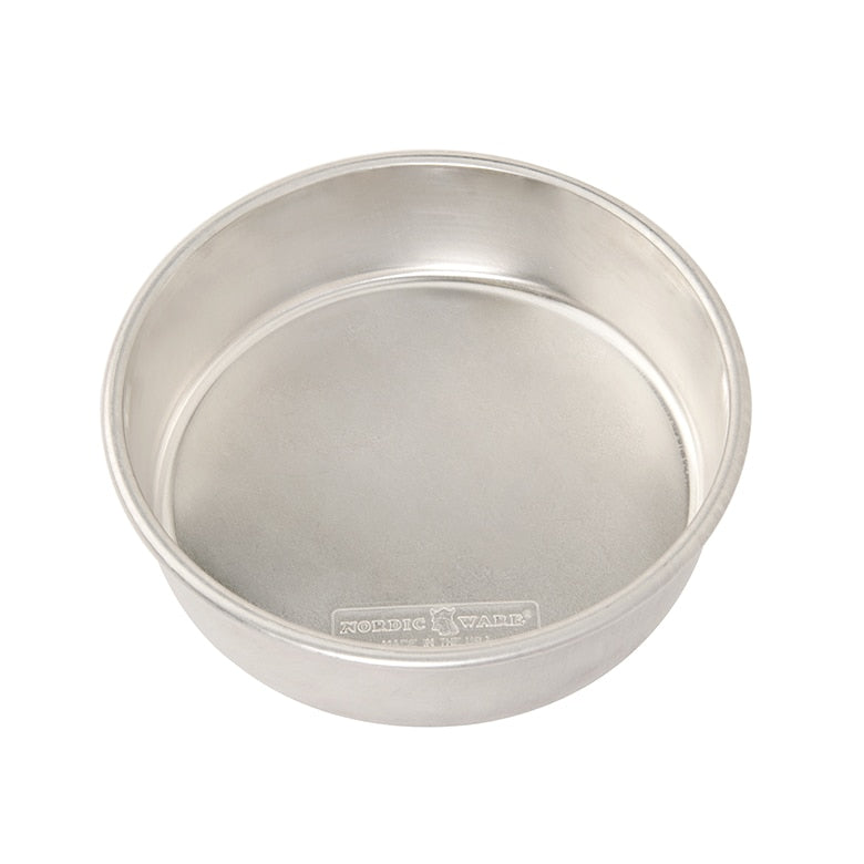 An 8-inch round cake pan made from durable metal, with a smooth surface and no visible handles or markings.