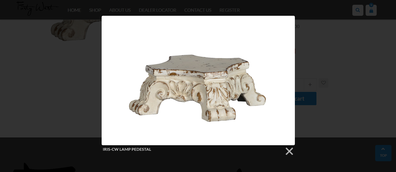 A white ornate pedestal lamp base with intricate designs and details.