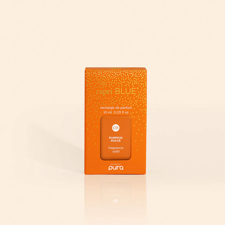 A box of Pura brand fragrance oil refill, with the name 'capri BLUE' visible on the packaging.