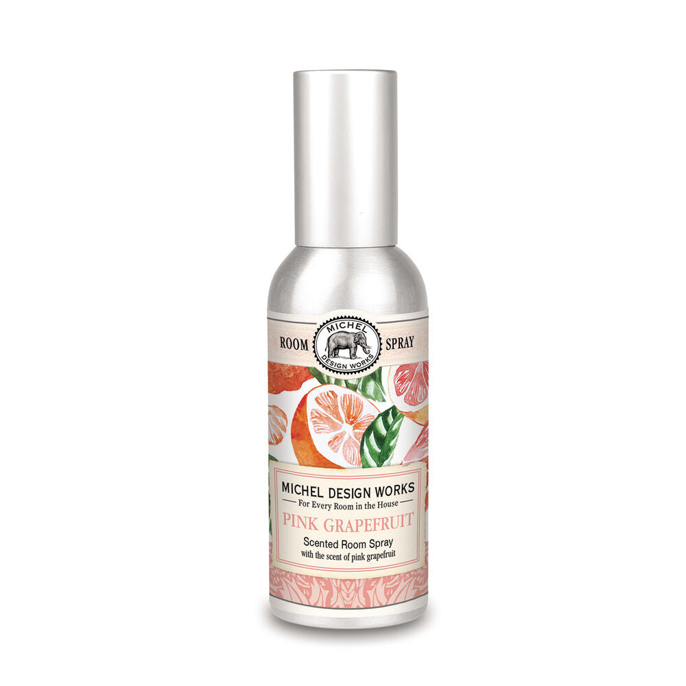 A bottle of MD ROOM SPRAY with a label showing pink grapefruit slices and leaves, indicating the scent of the room spray.