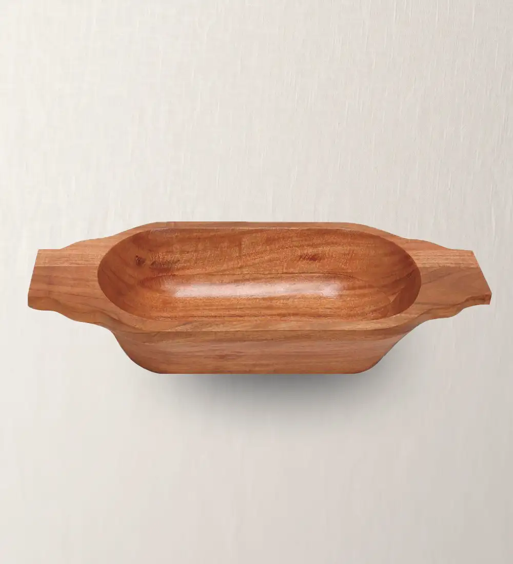 An oblong acacia wood bowl with handles on the sides, displayed against a neutral background.