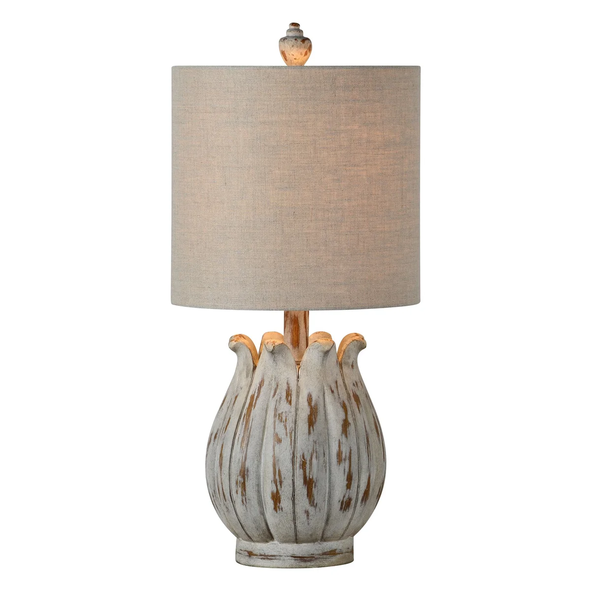 A beige table lamp with a textured white base and a beige lampshade, depicting a modern yet rustic design.