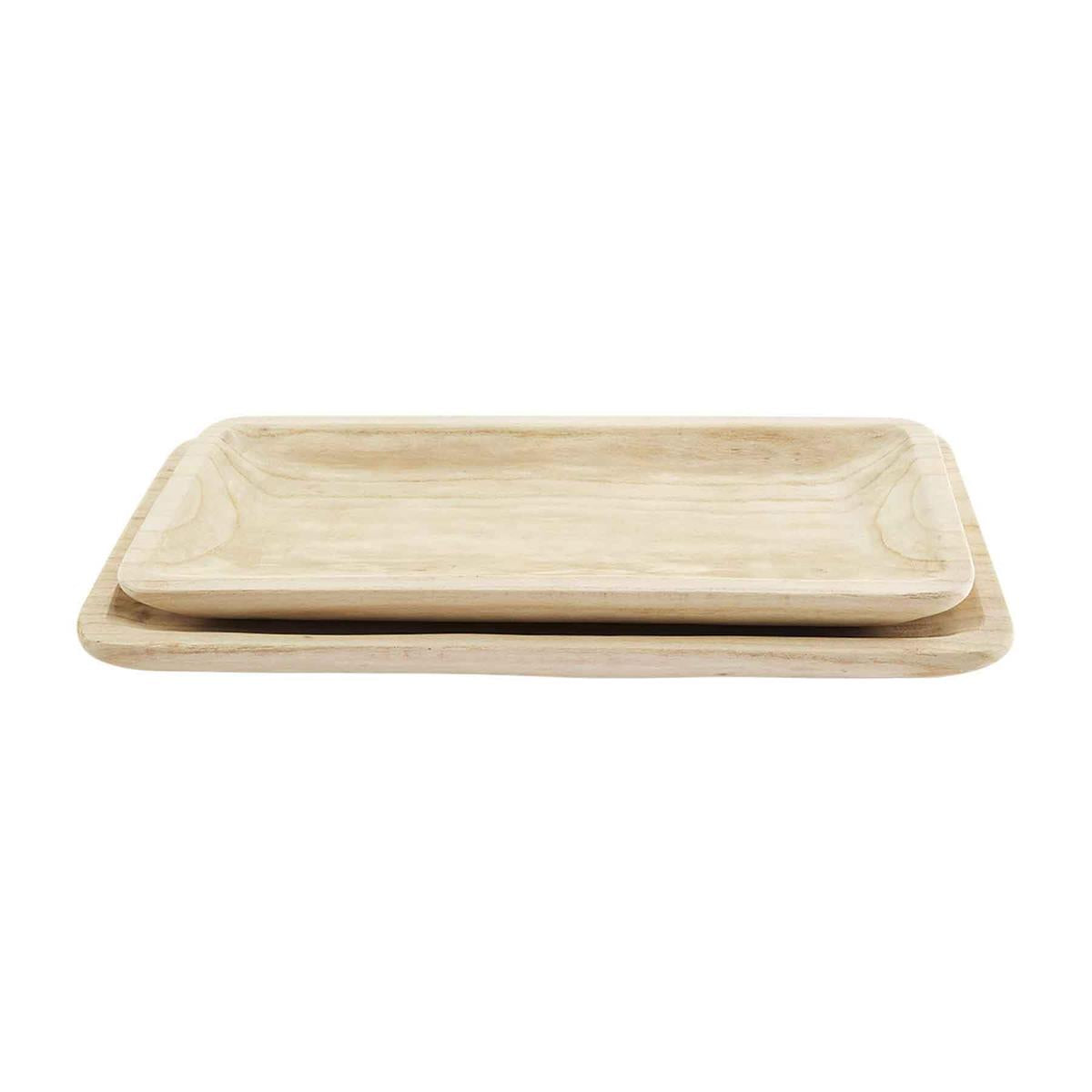 A beige, solid-wooden dough bowl with a smooth finish and natural imperfections.