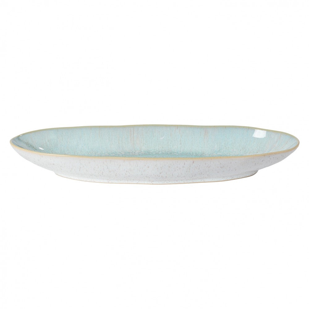 A blue and white oval platter with a textured edge.