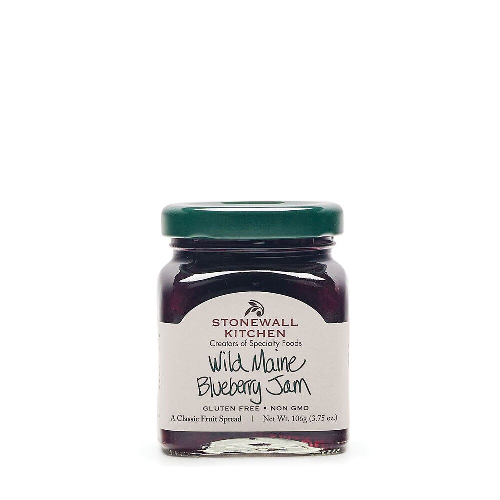 A jar of Wild Maine Blueberry Jam by Stonewall Kitchen, with a white label on a purple background.