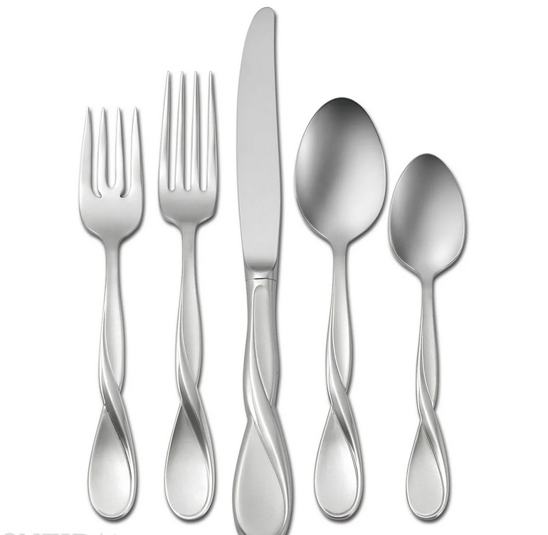 A set of stainless steel flatware, including a dinner knife, dinner fork, salad fork, soup spoon, and teaspoons, with a satin finish.