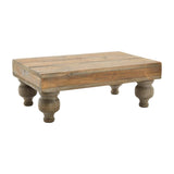 A rectangular, wooden footed serving stand with a flat surface and rounded edges.
