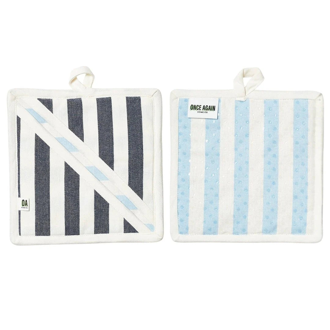 Two pot holders with striped patterns on a white background