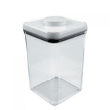 A white OXO POP Containers square-shaped food storage container with a transparent lid.