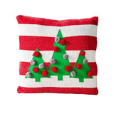 A square-shaped pillow with red and white stripes, featuring an appliqué design of green Christmas trees with silver and grey pom-pom ornaments.
