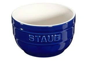 Blue Staub ceramic bowl on a white background