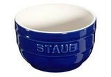Blue Staub ceramic bowl on a white background