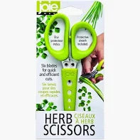 Herb scissors with green handles and packaging featuring a hand holding the scissors.
