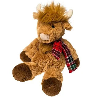 Plush toy lion with a plaid scarf on a white background