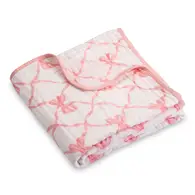 A white baby blanket with pink bows design, folded neatly.