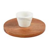 A wooden reverse pedestal chip and dip serving dish with a white cup on top.