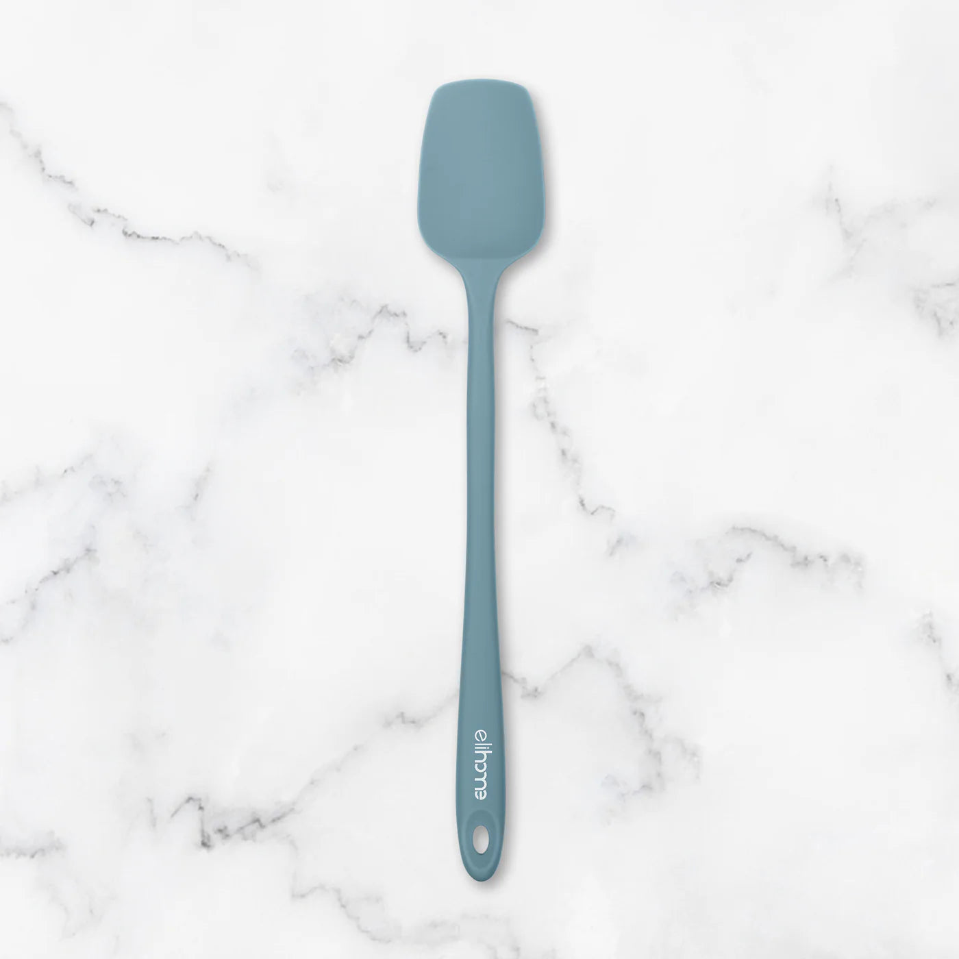 Blue spatula on a marble surface
