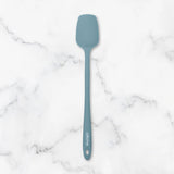 Blue spatula on a marble surface
