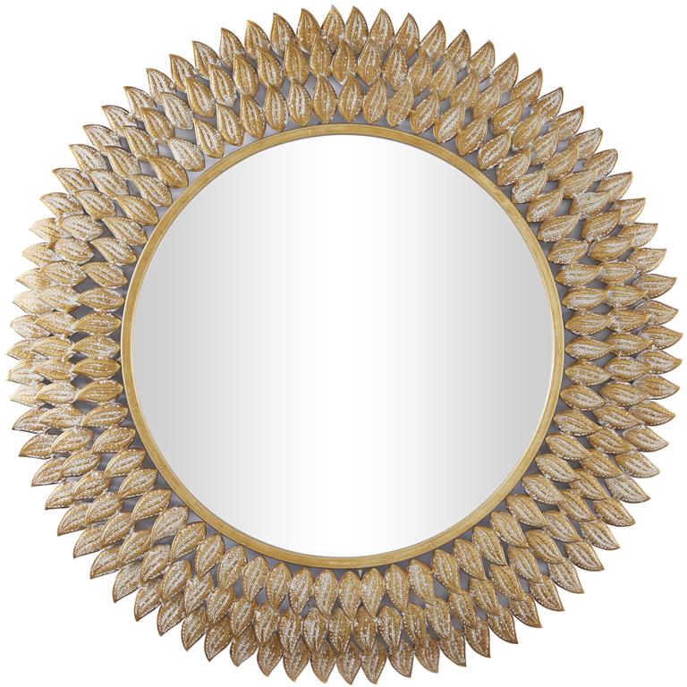 A round wall-mounted mirror with a gold frame and beige-colored mirrored surface, with visible nailhead trim.