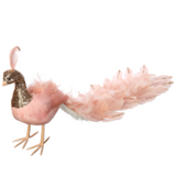 Pink toy duck with gold accents on a white background