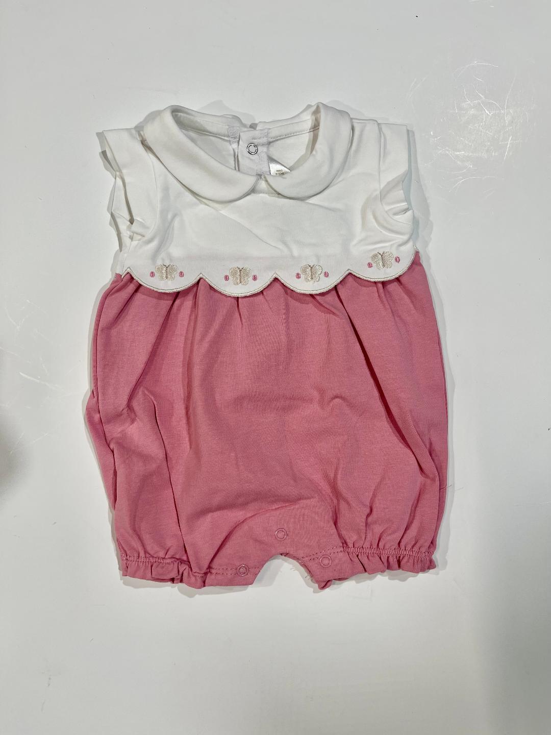 A pink and white baby romper with short sleeves and a Peter Pan collar
