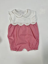 A pink and white baby romper with short sleeves and a Peter Pan collar