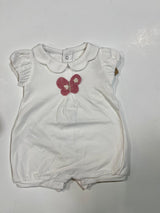 A white short-sleeved baby romper with a Peter Pan collar and a pink butterfly applique on the chest.