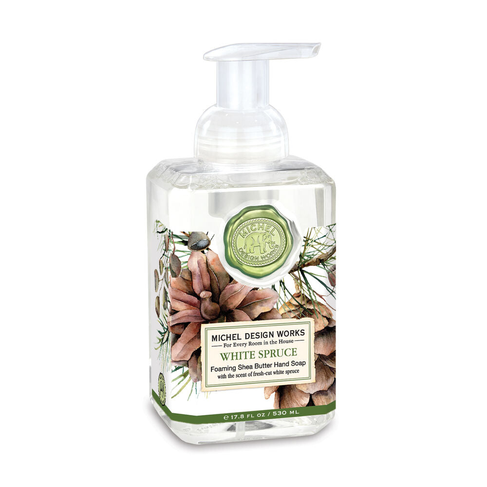 A pump bottle of MD Foam Soap with a white and green label, featuring an image of white spruce branches.