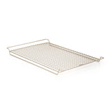 A nonstick cooling rack made of metal with a solid pattern and a handle on the side.