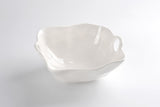 A large, white ceramic bowl with a smooth interior and an uneven exterior.