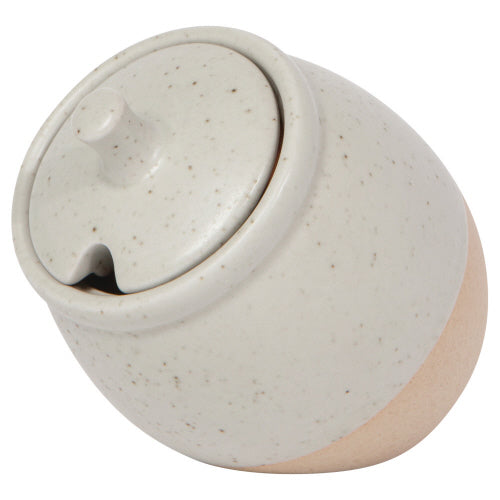 A beige and white ceramic sugar pot with a lid and a handle.
