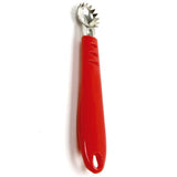 A red handheld strawberry and tomato corer with metal tines and a plastic handle.