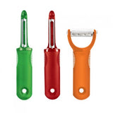 A set of three kitchen peelers in green, red, and orange colors with stainless steel blades and ergonomic handles.