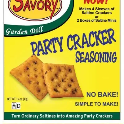 Packaging for Savory Party Cracker Seasoning, showing the product name, a green and white logo, and images of seasoned crackers. The package has text highlighting 'GARDEN DILL' flavor and 'NO BAKE!' instruction.