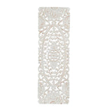 A white wood wall deco featuring a floral and geometric pattern.